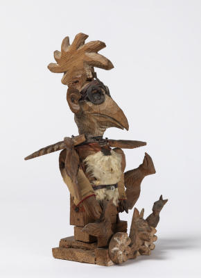 Personnage à tête d'oiseau avec lunettes
